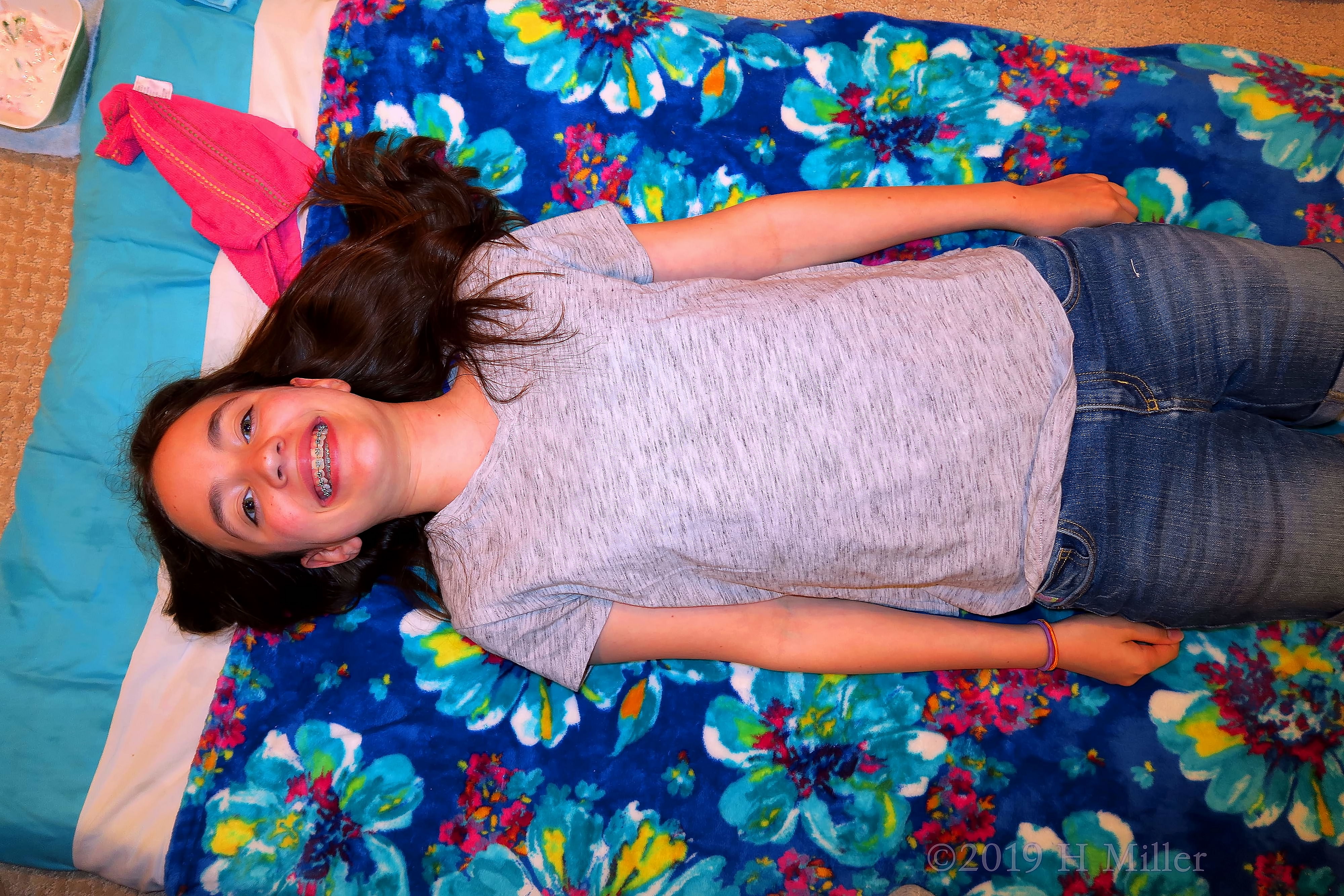 Girl Laying On The Spa Mat Ready For Girls Facials Girl Laying On The Spa Mat Ready For Girls Facials